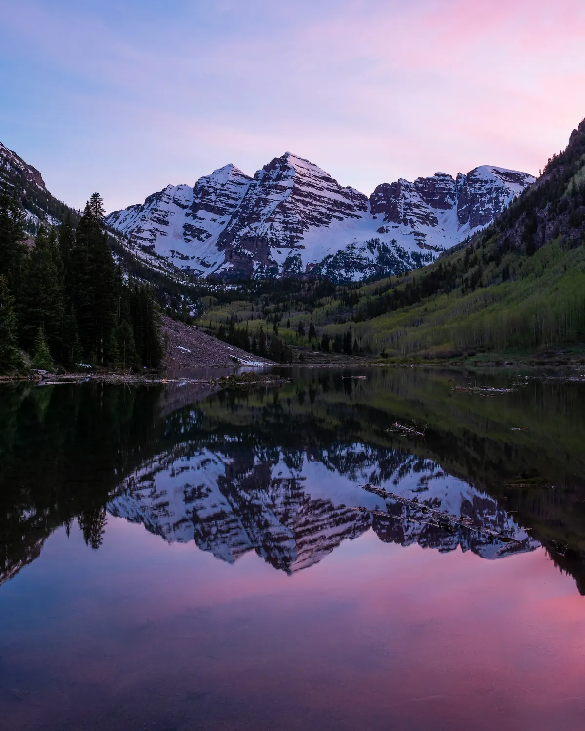 The Maroon Bells reflected in Maroon Lake in summer